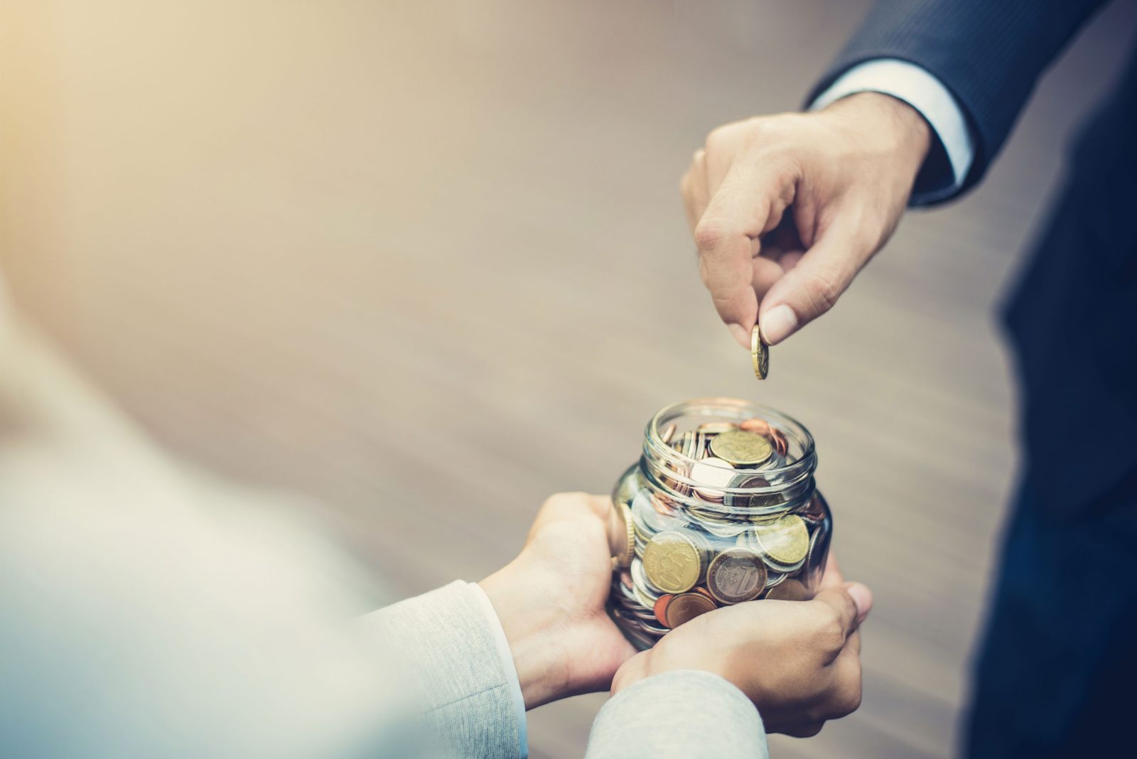Coins being collected for fundraising in support of The Open Door's services.